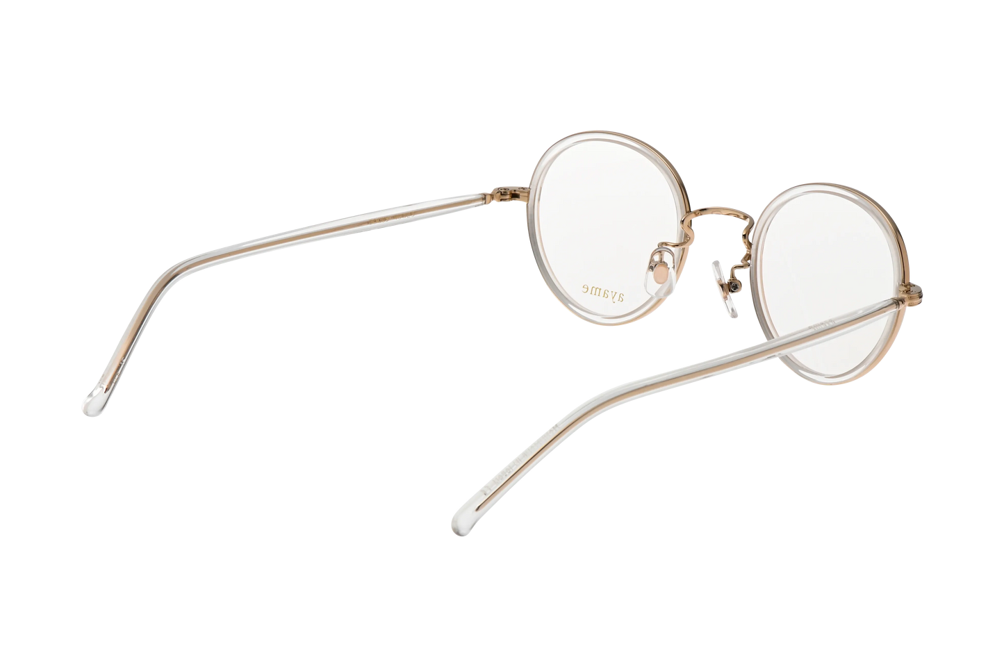 フォーカスメガネのクリア斜め後ろ クリアのテンプルにホワイトゴールドの芯が透けて見える